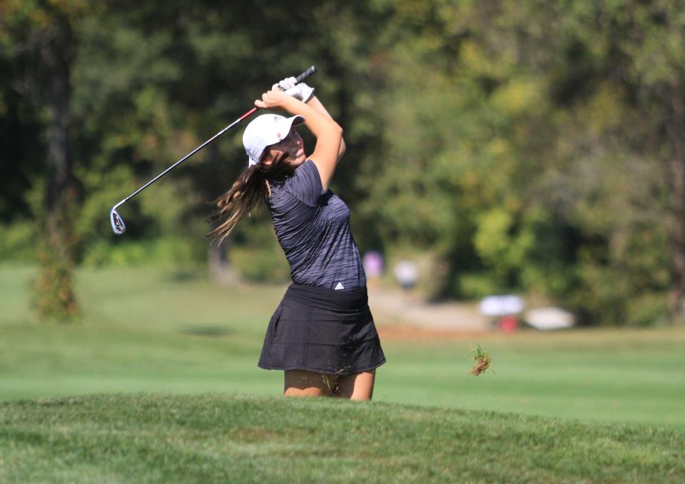 Lakewood's Avery Thompson watches her approach shot on No. 15 during the Division II district tournament at Darby Creek on Monday, Oct. 2, 2023. Thompson took co-medalist honors to qualify for state.