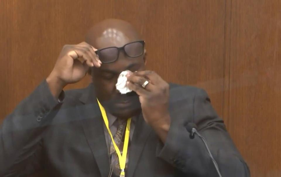 In this image from video, Philonise Floyd, brother of George Floyd, becomes emotional as he testifies as Hennepin County Judge Peter Cahill presides over court Monday, April 12, 2021, in the trial of former Minneapolis police Officer Derek Chauvin, in the May 25, 2020, death of George Floyd at the Hennepin County Courthouse in Minneapolis, Minn. (Court TV via AP, Pool)