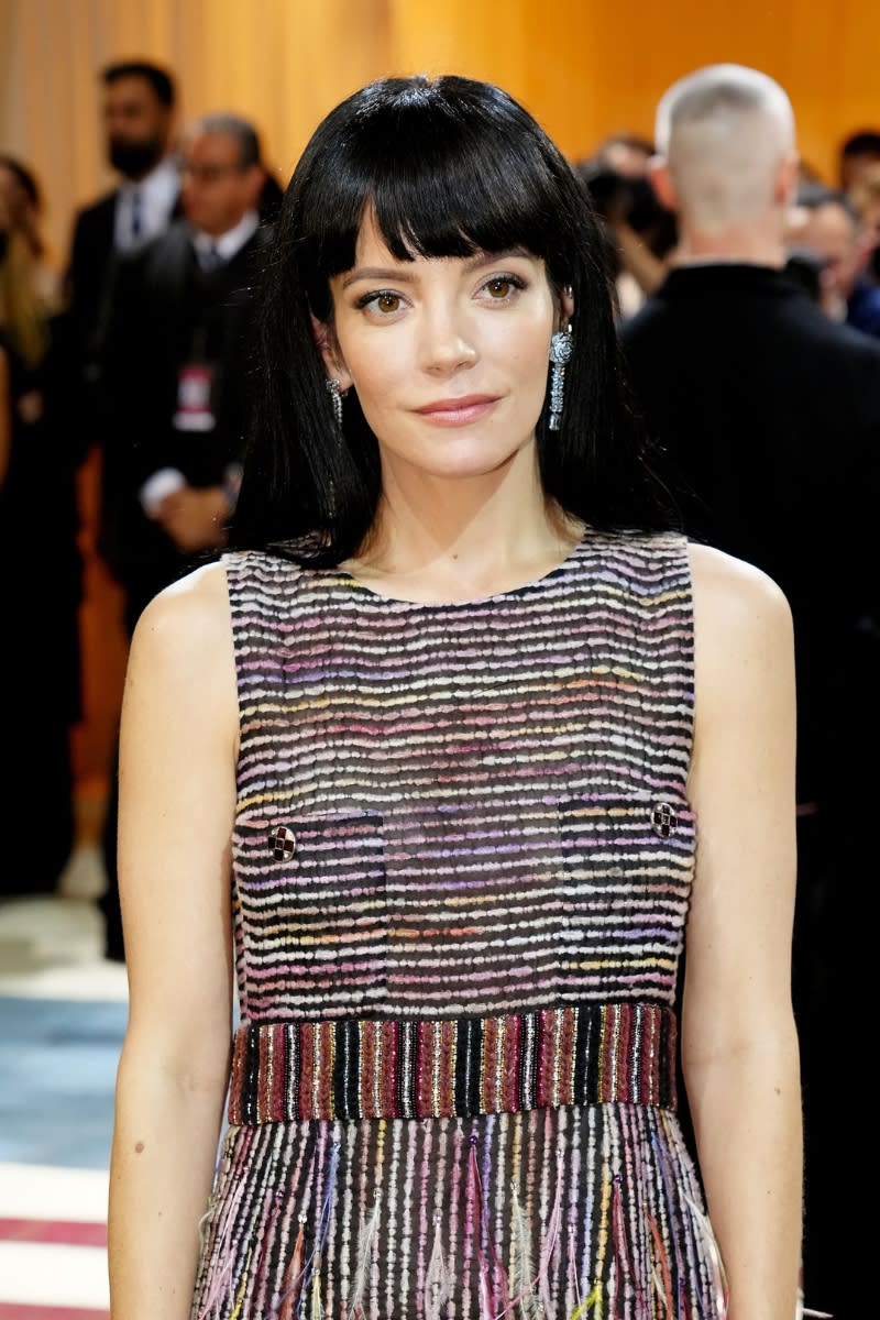 Lily Allen is pictured with black hair and a full fringes as she attends The 2022 Met Gala Celebrating 