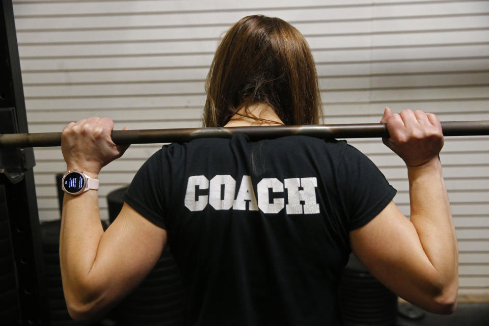 Melissa Breaux Bankston, a CrossFit athletic trainer at CrossFit Algiers in New Orleans, poses for a portrait at the gym Monday, Dec. 23, 2019. She participates in an intermittent fasting diet. (AP Photo/Gerald Herbert)