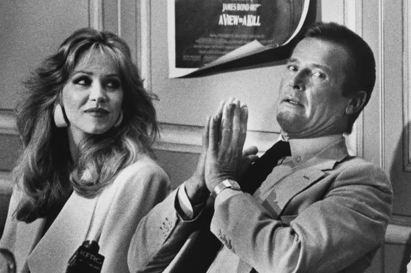 Roger Moore and Tanya Roberts discuss Moore's final Bond film, "A View to a Kill," at a press conference in San Francisco on May 21, 1985. File Photo by Lloyd Francis/UPI