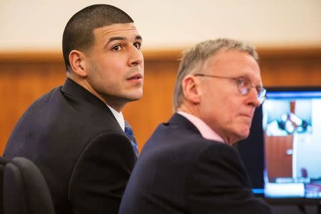 Aaron Hernandez sits with his attorney Charles Rankin during his murder trial at the Bristol County Superior Court in Fall River, Massachusetts, March 17, 2015. REUTERS/Aram Boghosian/Pool