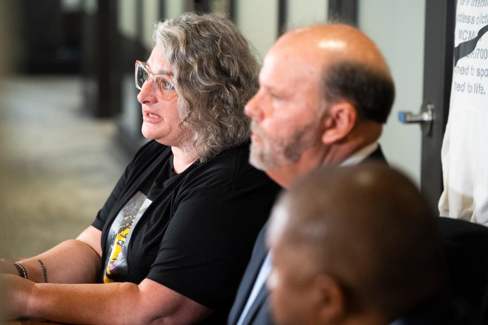 Donovan Lewis' mother, Rebecca Duran, from left, Attorney Rex Elliott and Attorney Michael Wright speak Friday during a news conference at Cooper Elliott Law Offices in Columbus after a grand jury indicted former Columbus police officer Ricky Anderson with murder in connection with the fatal shooting of Lewis in August 2022.