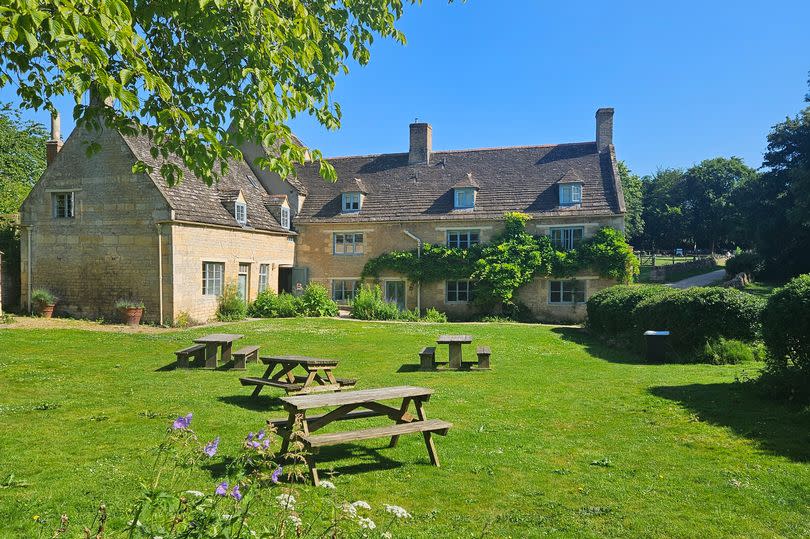 Picnic benches in the Mill Garden is a perfect way to spend a summer day