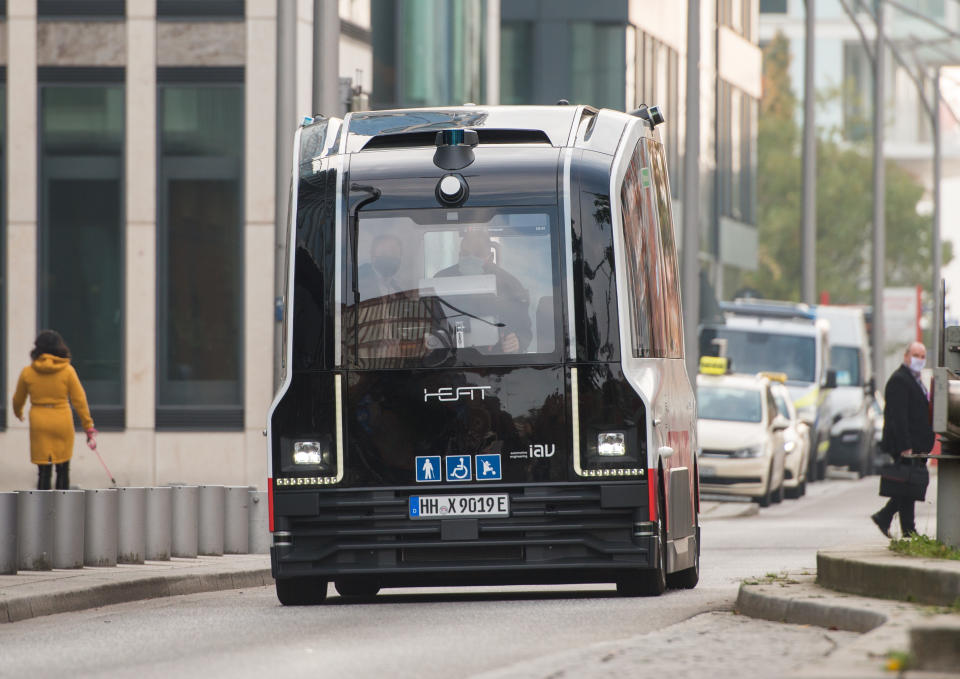 23 October 2020, Hamburg: A Hamburger Hochbahn minibus running without a driver drives through HafenCity. The first passengers have been able to use the autonomous shuttle since Friday. Photo: Daniel Bockwoldt/dpa (Photo by Daniel Bockwoldt/picture alliance via Getty Images)