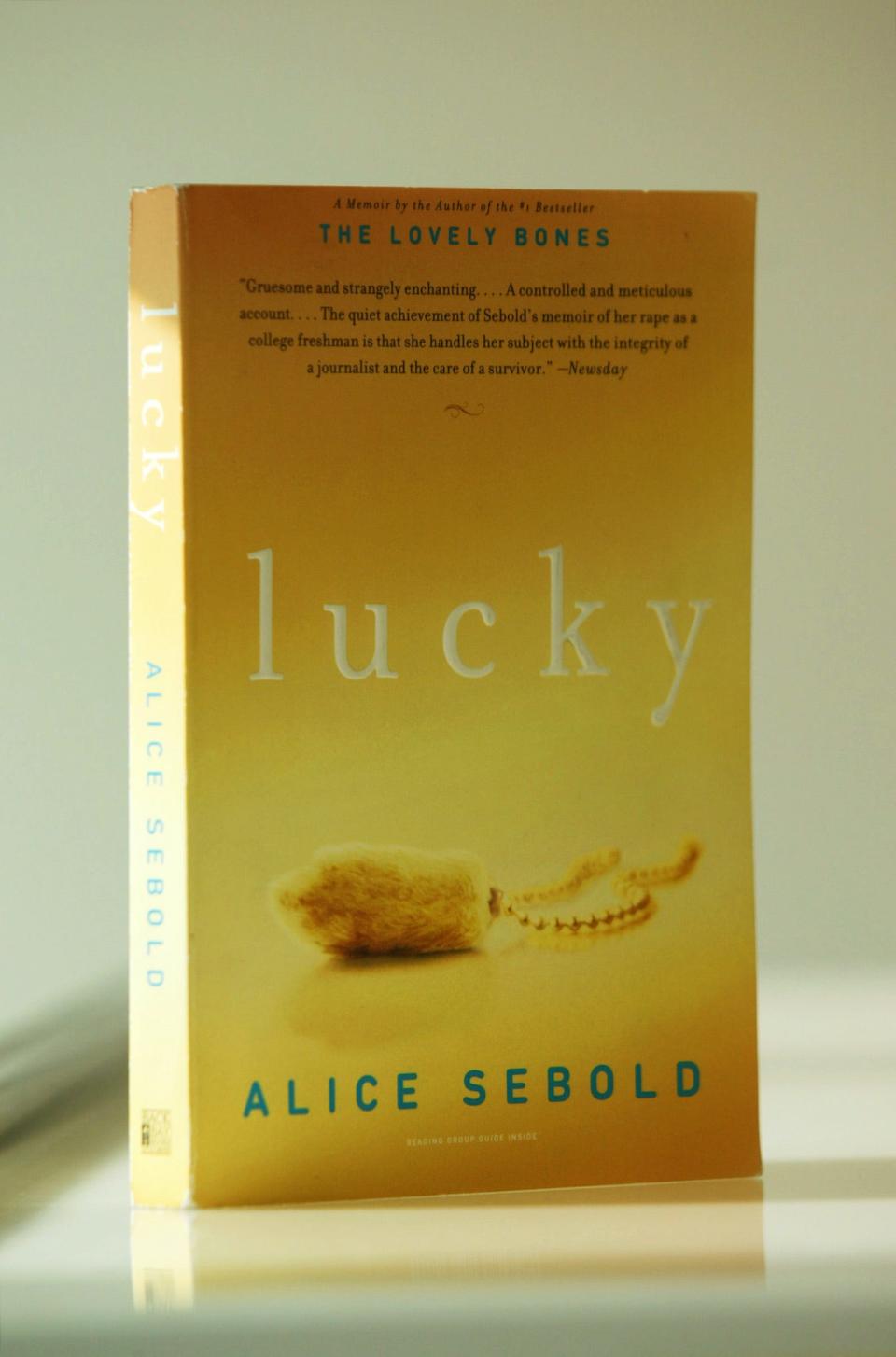 This is a paperback copy of Lucky by Alice Sebold.