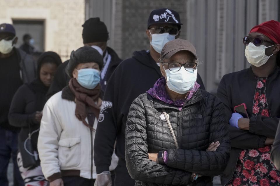 Voters wait in line to cast ballots at Washington High School while ignoring a stay-at-home order over the coronavirus threat to vote in the state's presidential primary election, Tuesday, April 7, 2020, in Milwaukee. (AP Photo/Morry Gash)