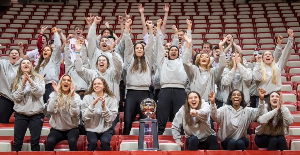 Surrounding the Big Ten Championship Trophy, the Indiana Hoosiers react to being announced a 1-seed during the broadcast of the reveal of the 2023 NCAA Women's Tournament bracket at Simon Skjodt Assembly Hall on Sunday, March 12, 2023.