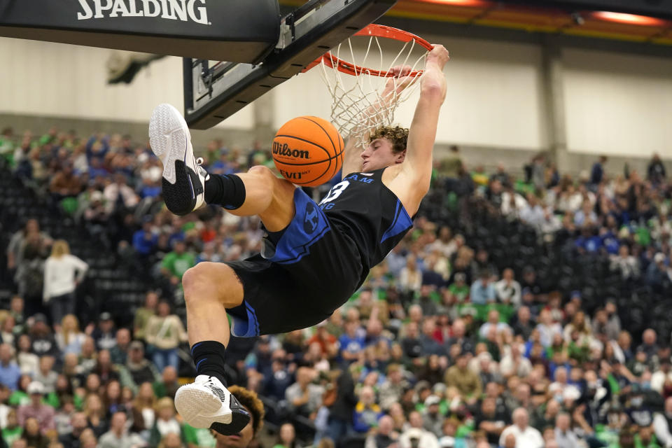 BYU forward Caleb Lohner dunks against Utah Valley in the first half during an NCAA college basketball game Wednesday, Dec. 1, 2021, in Orem, Utah. (AP Photo/Rick Bowmer)