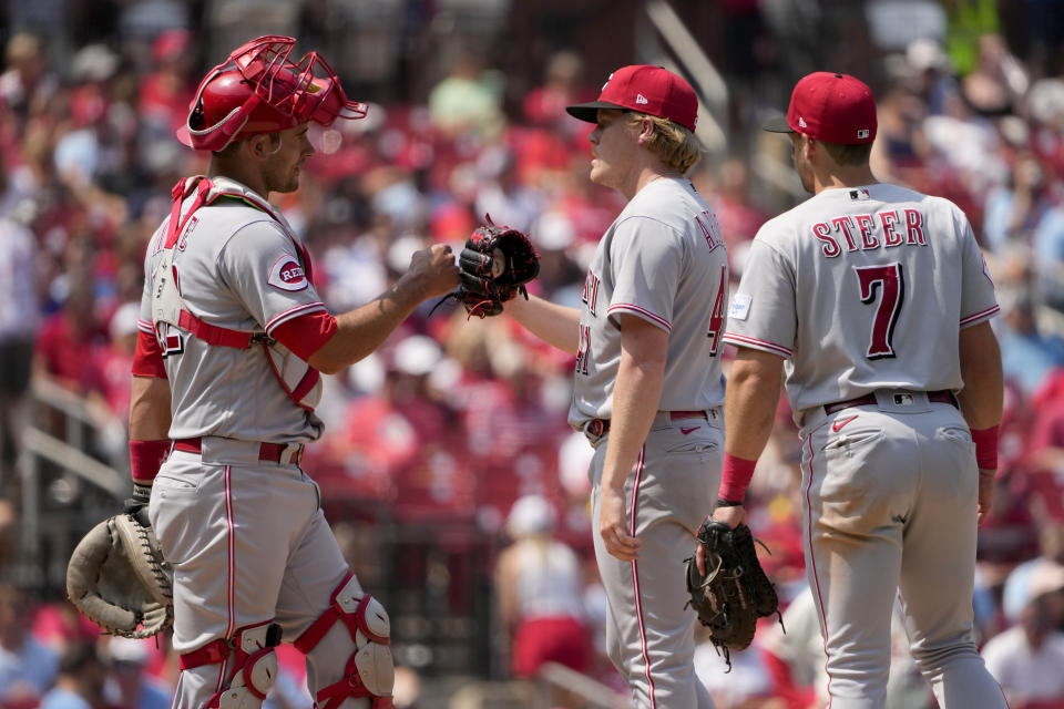 CORRECTS TO SIXTH INNING NOT SEVENTH INNING - Cincinnati Reds starting pitcher Andrew Abbott, center, is congratulated by teammates Luke Maile, left, and Spencer Steer (7) before being removed during the sixth inning of a baseball game against the St. Louis Cardinals, Saturday, June 10, 2023, in St. Louis. (AP Photo/Jeff Roberson)