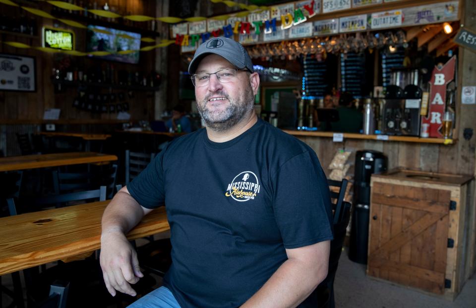 Mississippi Ale House owner Derric Curran sits in the indoor seating area Thursday, June 30, 2022, at Mississippi Ale House in Olive Branch. 