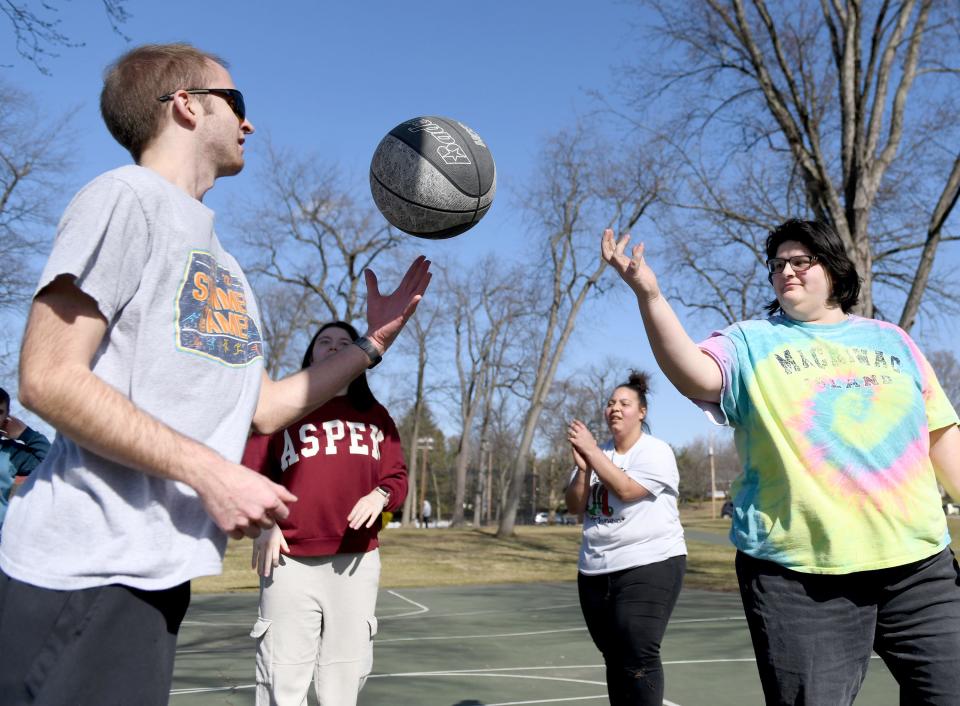 Kameron Long, left, and Simora Sheetz with KBY Services in Canton play a friendly game of basketball at Price Park in North Canton.