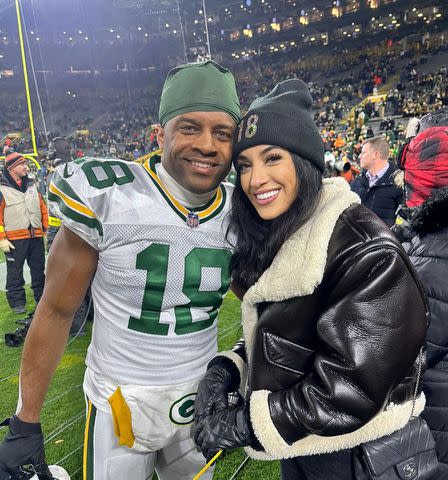 <p>Aiyda Cobb/ Instagram</p> Randall Cobb and Aiyda Cobb on the field at a Green Bay Packers football game.