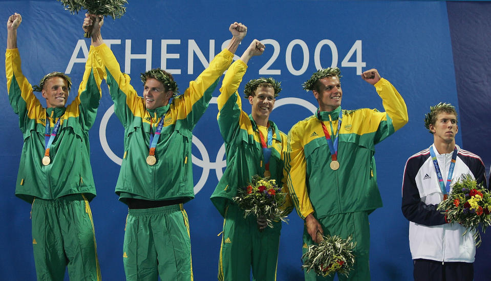 <b>Medal No. 8</b><br>ATHENS - AUGUST 15, 2004: Michael Phelps looks on at the winning relay team of South Africa after winning bronze in the 4 x 100 meter freestyle relay final.