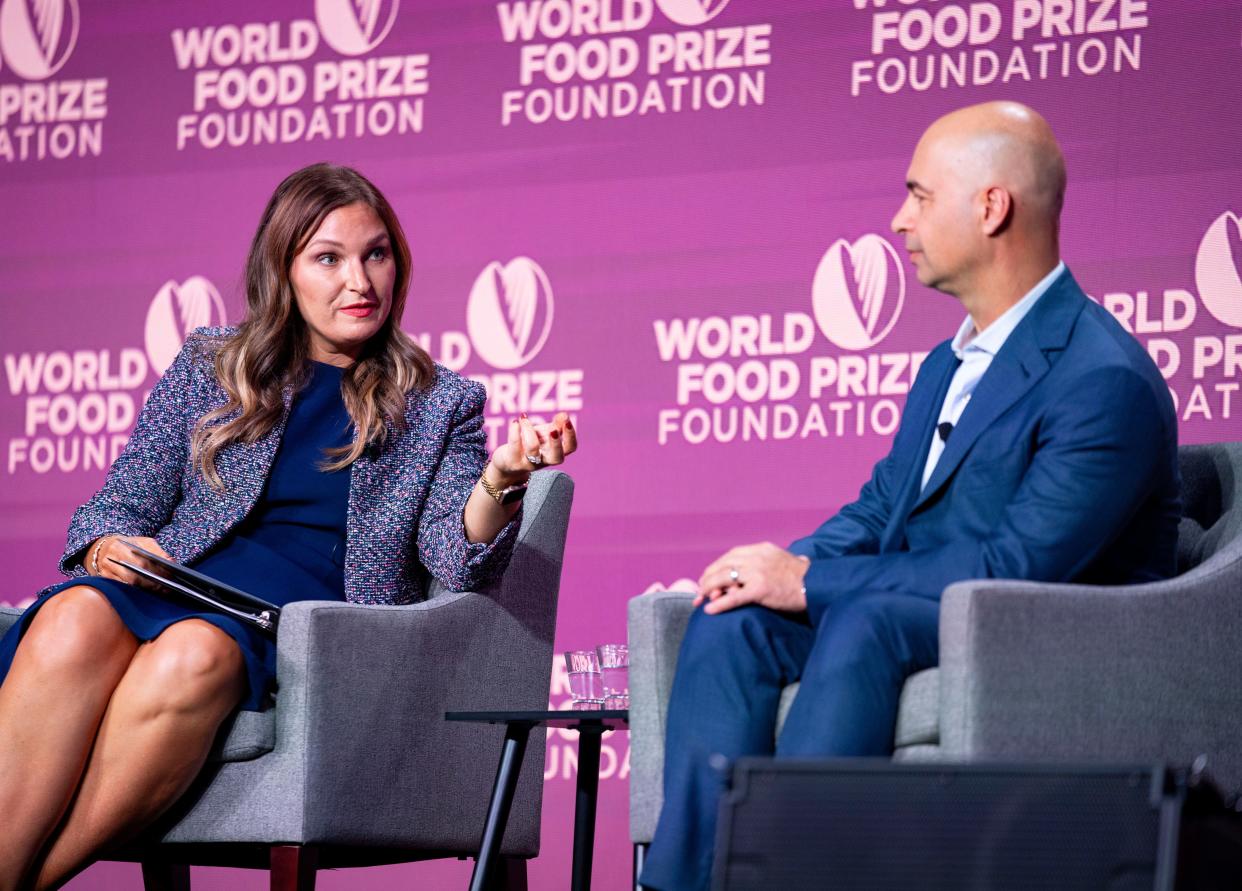 Farmer Julie Kenney, left, and Chuck Magro, CEO of Corteva Agriscience have a ÒFireside ChatÓ about the challenges farmers face during the Borlaug International Dialogue held by the World Food Prize Foundation, Wednesday, Oct. 25, 2023.
