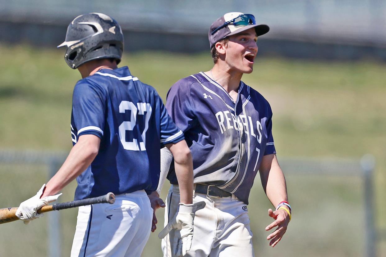 South Kingstown's Brandon Westerfield, right, and teammate Jonah Monnes celebrate during a game last season. On Friday, the two combined to lead the Rebels to a 9-1 victory over Moses Brown
