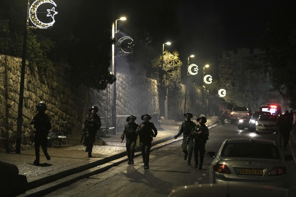 Israeli Border Police are deployed near the Lions' Gate to the Old City of Jerusalem during a raid by police of Al-Aqsa Mosque, Wednesday, April 5, 2023. Palestinian media reported police attacked Palestinian worshippers, raising fears of wider tension as Islamic and Jewish holidays overlap. (AP Photo/Mahmoud Illean)