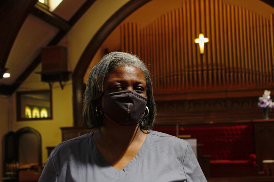 In this photo taken May 6, 2021, Ericka Sinclair, CEO of Health Connections, poses for a photo at St. Matthew Christian Methodist Episcopal Church in Milwaukee. Her local health clinic is working with Pastors United, Milwaukee Inner City Congregations Allied for Hope and Souls to the Polls to get more African Americans vaccinated by holding clinics in churches. (AP Photo/Carrie Antlfinger)