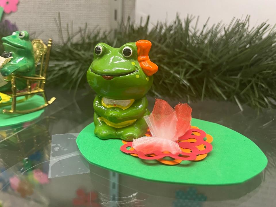 The Fountain City Library branch staff lovingly made lily pads, lilies, dragonflies and bees to adorn the Martinson Frogs.