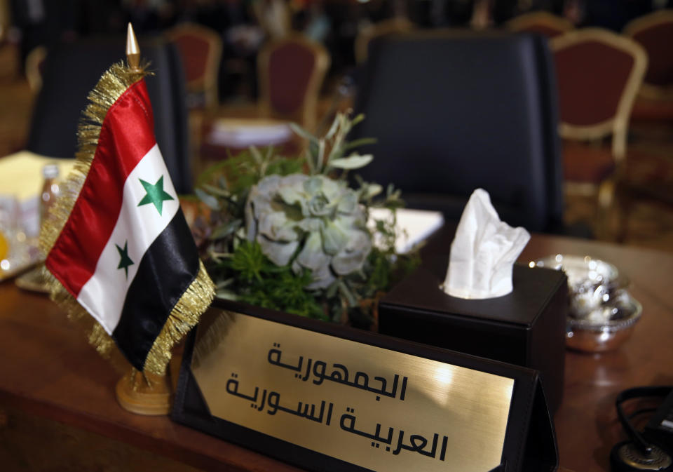 The chair of the Syrian Arab Republic is empty at the opening session of the Arab foreign ministers meeting ahead of a weekend Arab Economic Summit, in Beirut, Lebanon, Friday, Jan. 18, 2019. The Arab Economic and Social Development Summit, or AESD, is being held in Lebanon for the first time amid sharp divisions in the country and among Arab countries. (AP Photo/Hussein Malla)