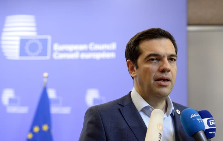 Greek Prime Minister Alexis Tsipras talks to reporters at the end of an Eurozone Summit in Brussels, on July 13, 2015