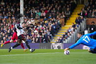 Liverpool's Diogo Jota scores his side's third goal during the English Premier League soccer match between Fulham and Liverpool at Craven Cottage stadium in London, Sunday, April 21, 2024. (AP Photo/Kirsty Wigglesworth)