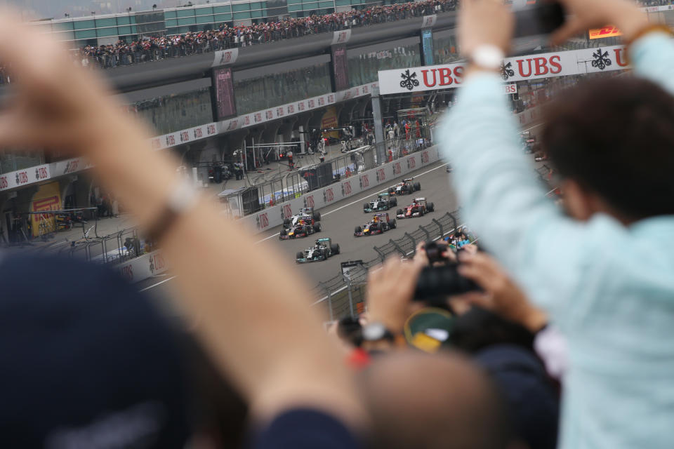 Mercedes driver Lewis Hamilton of Britain leads at the start of the Chinese Formula One Grand Prix at Shanghai International Circuit in Shanghai, Sunday, April 20, 2014. (AP Photo/Eugene Hoshiko)