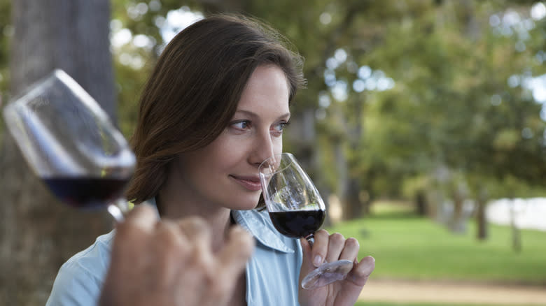 Woman tasting wine