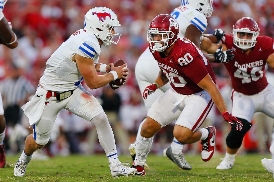 Defensive lineman Rondell Bothroyd #80 of the Oklahoma Sooners flushes quarterback Preston Stone #2 of the SMU Mustangs out of the pocket in the third quarter Sept. 9, 2023, at Gaylord Family Oklahoma Memorial Stadium in Norman, Oklahoma. Oklahoma won 28-11.