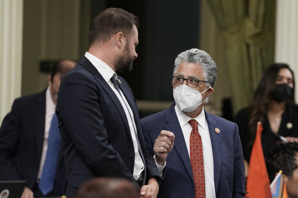 State Senator Anthony Portantino, D-La Canada Flintridge, right, talks with Assemblyman Matt Haney, D-San Francisco during the Assembly session at the Capitol in Sacramento, Calif., Wednesday, Aug. 31, 2022. For the second night in a row California lawmakers failed to approve Portantino's measure to replace limits on carrying concealed weapons permits that were struck down by a recent U.S. Supreme Court ruling. (AP Photo/Rich Pedroncelli)