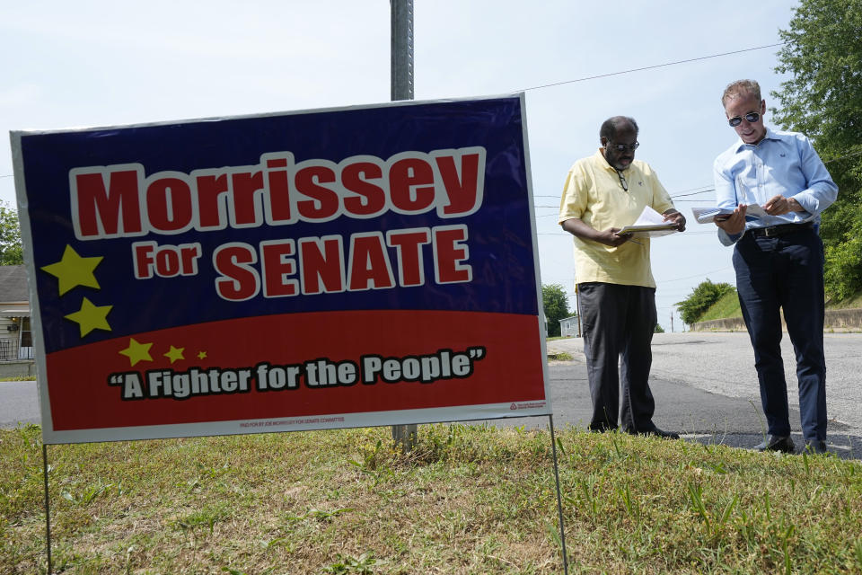 Virginia state Sen. Joe Morrissey, right, talks with a volunteer as he prepares to canvas a neighborhood, Monday, May 22, 2023, in Petersburg, Va. Morrissey is being challenged in a Democratic primary for a newly redrawn senatorial district by former Delegate Lashrecse Aird. (AP Photo/Steve Helber)