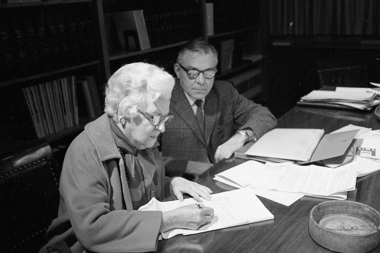 Mrs. Grace McConnell Dimity signs over the deed of the McConnel Farm to Chillicothe Hospital officials in 1970 with Wayne Foster, hospital administrator, present.