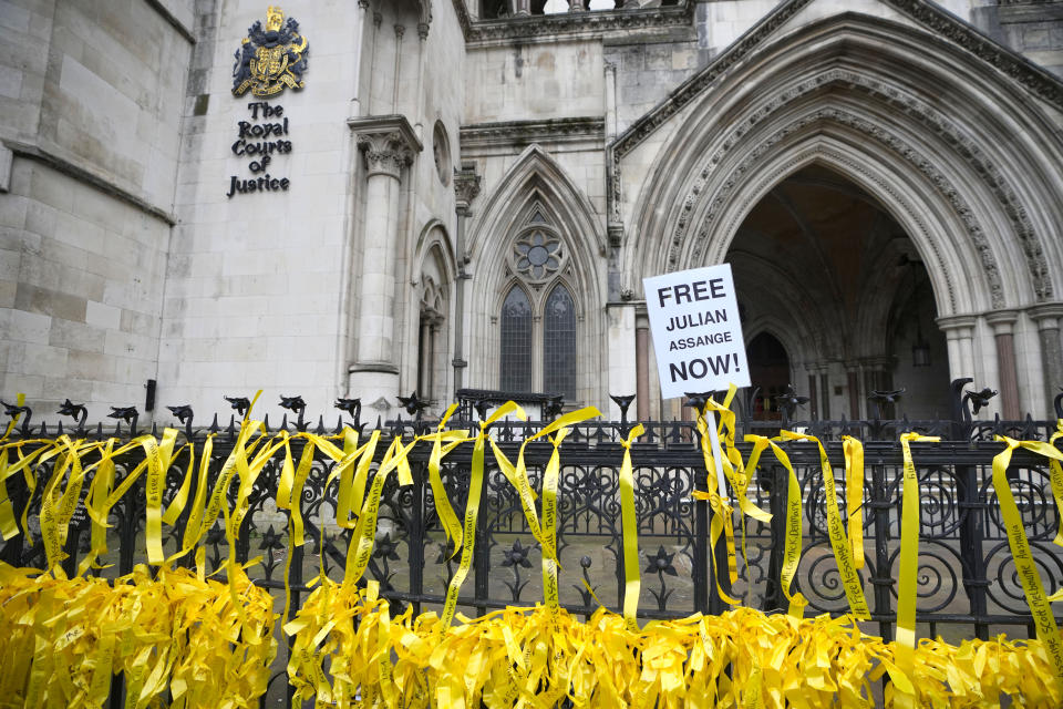 Ribbons are tied to the railings outside the Royal Courts of Justice in London, Tuesday, Feb. 20, 2024. WikiLeaks founder Julian Assange will make his final appeal against his impending extradition to the United States at the court. (AP Photo/Kirsty Wigglesworth)