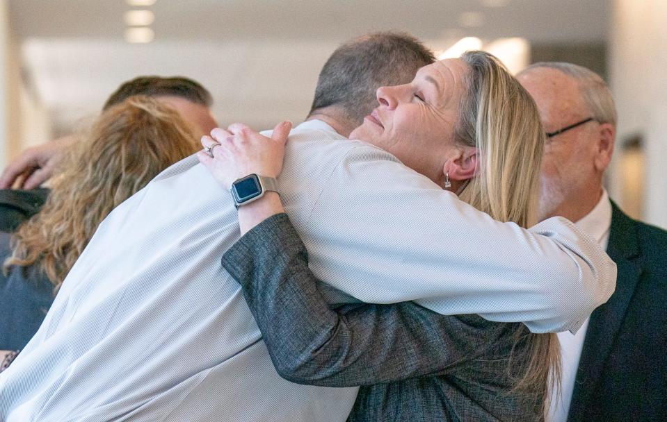 Mike Kennedy, hugs his niece, Angie Hibbs, before the trial of Robert Atkins at the Bucks County Justice Center in Doylestown on Monday, Jan. 29, 2024.

Daniella Heminghaus | Bucks County Courier Times