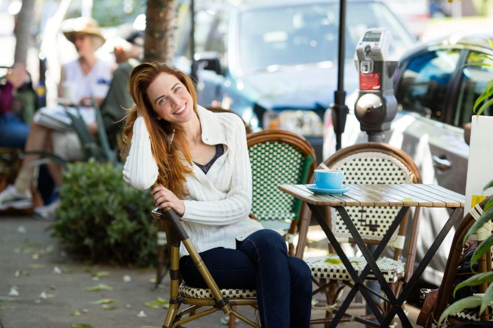 A woman named Megan in Studio City, California, US, sitting at an outdoor cafe