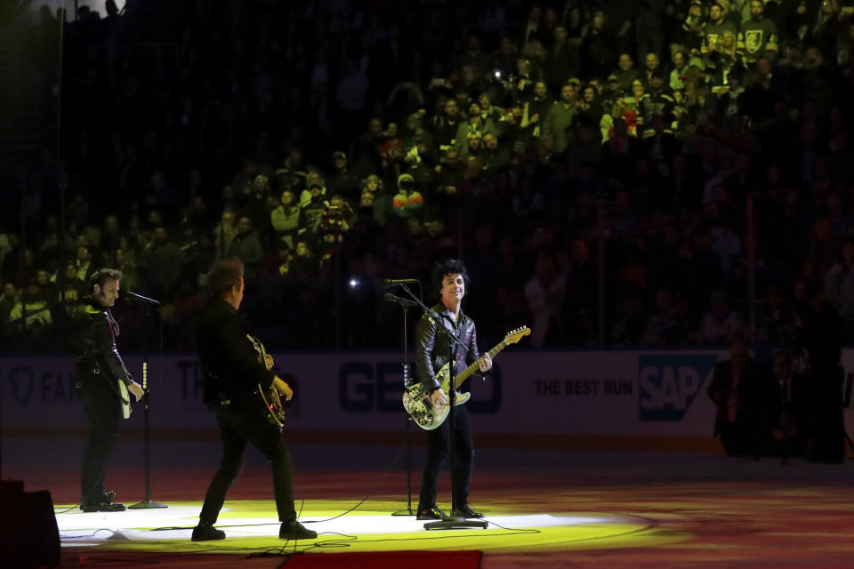 The group Green Day performs between NHL hockey All Star games Saturday, Jan. 25, 2020, in St. Louis. (AP Photo/Jeff Roberson)