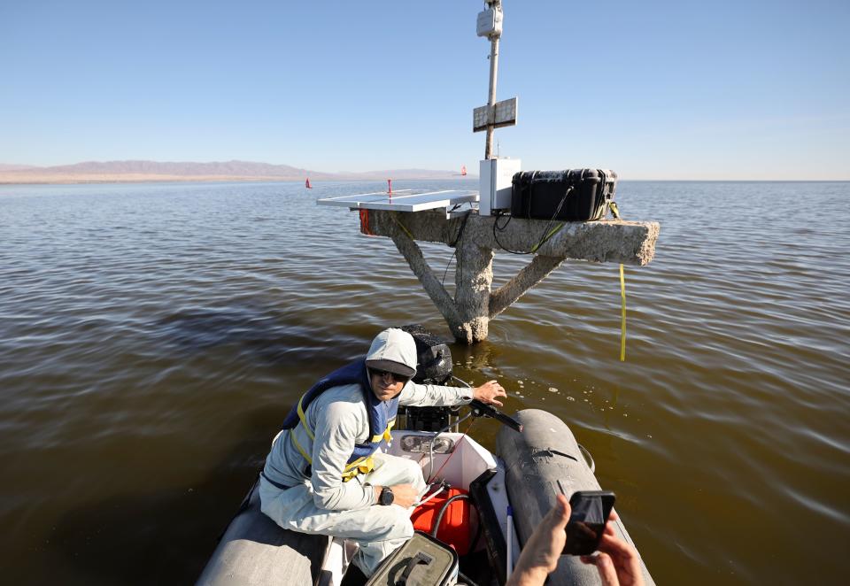 Quinn Montgomery, Alianza consultant biologist, steers a boat away from a solar powered hydrogen sulfide sensor in the Salton Sea, Calif., on Thursday, Dec. 14, 2023. The sensor also measures nitrogen dioxide and volatile organic compounds. Hydrogen sulfide is a toxic gas that smells of rotten eggs. | Kristin Murphy, Deseret News