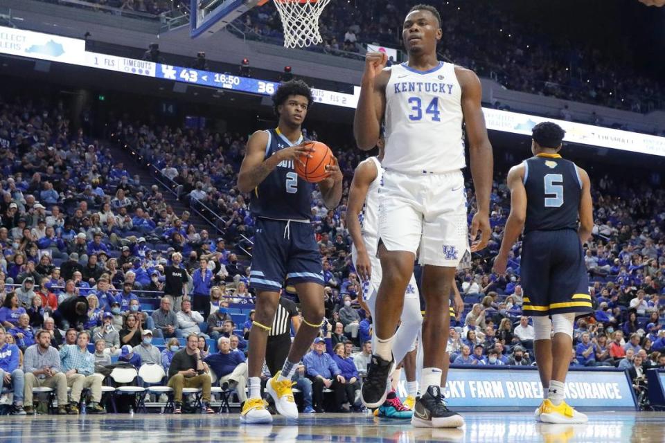 Kentucky’s Oscar Tshiebwe (34) celebrated near Southern’s J’Quan Ewing (2) and Jayden Saddler (5) during Tuesday’s game. Tshiebwe finished with 23 points, 11 rebounds, four blocks and two steals.