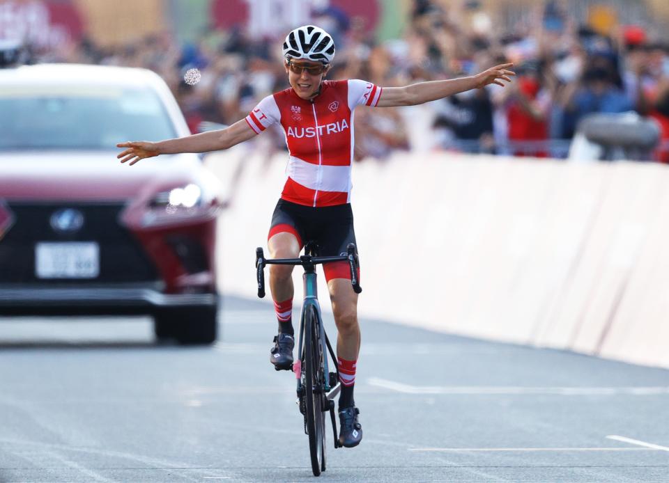 Anna Kiesenhofer celebrates winning a shock gold for Austria (Getty)