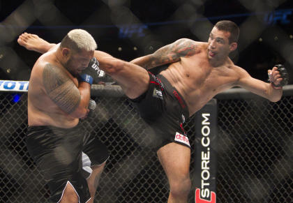 Fabricio Werdum, right, battles Mark Hunt during UFC 180. (AP)