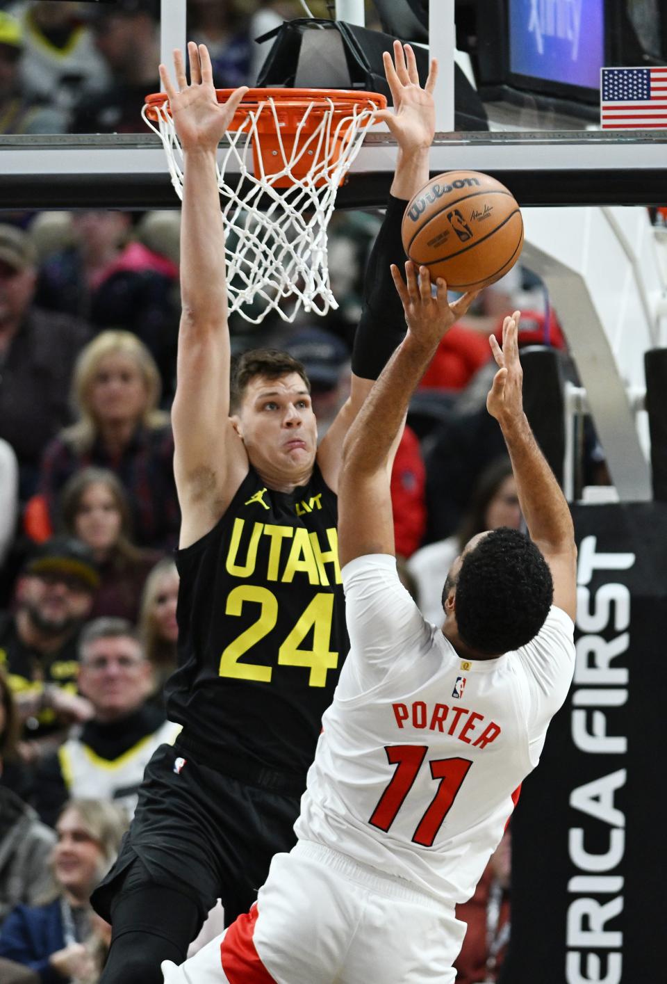 Utah Jazz center Walker Kessler (24) defends Toronto Raptors center Jontay Porter (11) at the hoop as the Jazz and Raptors play at the Delta Center in Salt Lake City on Friday, Jan. 12, 2024. Utah won 145-113.