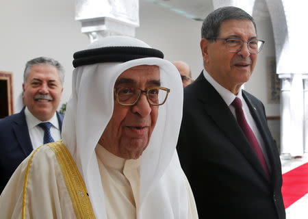 Bahrain's Deputy Prime Minister, Sheikh Mohammad bin Mubarak al-Khalifa, who will represent his country on the Arab Summit, walks next to the Tunisian Presidential Advisor for Political Affairs, Habib Essid, at Tunis-Carthage international airport, in Tunis, Tunisia, March 30, 2019. Hussein Malla/Pool via REUTERS