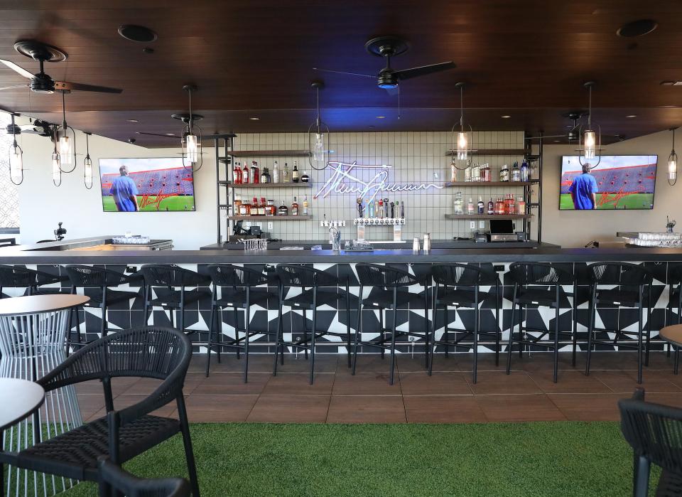 The bar at Visors Rooftop at Spurrier's Gridiron Grille commonly hosts radio shows with current Florida Gators coaches.