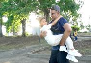 Singaporean Mohammad Faris Abdullah, 37, reunites with his 6-year-old son Muhammad Ishaq bin Mohammad Faris after being separated for two years amid the COVID-19 pandemic in Johor