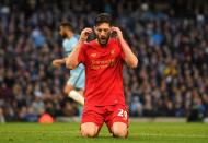 <p>Lallana cannot believe it after missing a simple chance for Liverpool </p>