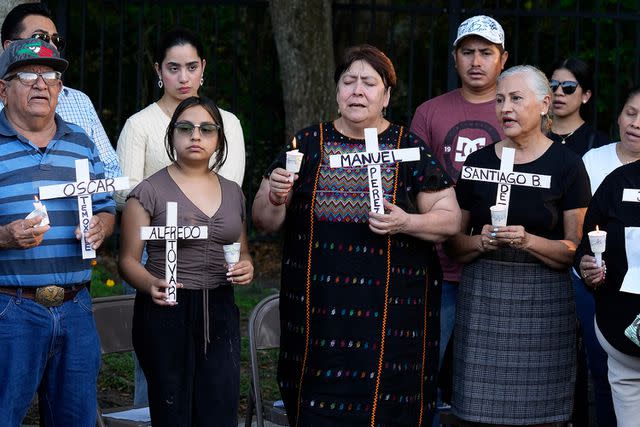 <p>AP Photo/Chris O'Meara</p> Mourners honor the victims of the crash at a vigil
