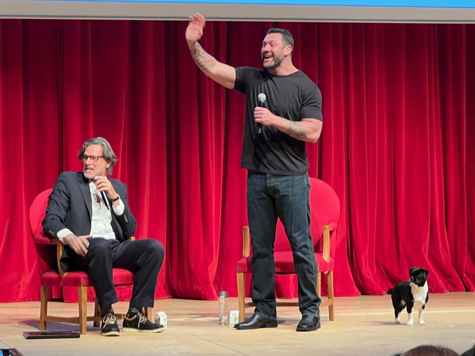 Renowned animal rescue hero Lee Asher speaks to well-wishers after a talk at Lynn University.