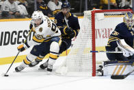 Nashville Predators center Matt Duchene (95) moves the puck in front of Buffalo Sabres defenseman Rasmus Ristolainen (55), of Finland, during the second period of an NHL hockey game Saturday, Jan. 18, 2020, in Nashville, Tenn. (AP Photo/Mark Zaleski)