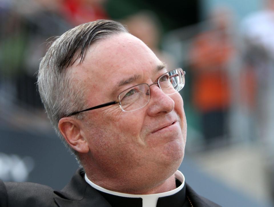 The Rev. Christopher J. Coyne smiles after he gives the invocation before the Indy 500 runs at the Indianapolis Motor Speedway, Sunday, May 29, 2011. In August, Coyne, now the bishop of the Roman Catholic Diocese of Burlington, released the names of 40 priests found credibly accused of child sex abuse.