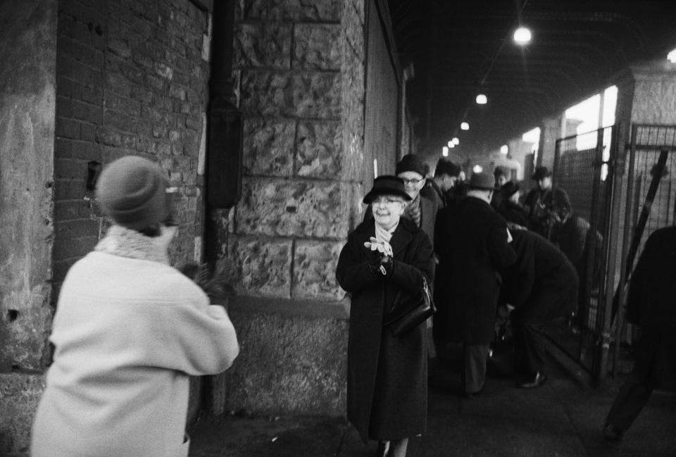 22/12/1963- West and East Berliners embrace as they meet at Oberbaum Bridge border crossing point. For the first time since the Communists set up their wall in 1961, West Berliners could get special passports permitting them to cross the sector border for Christmas visits to their East Berlin relatives. Thousands of West Berliners crossed, and thousands queued every day in front of the pass bureaus. Picture- Corbis Images